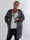 Elizabeth - Lang plus size strikcardigan med fint hulmønster på ærmerne