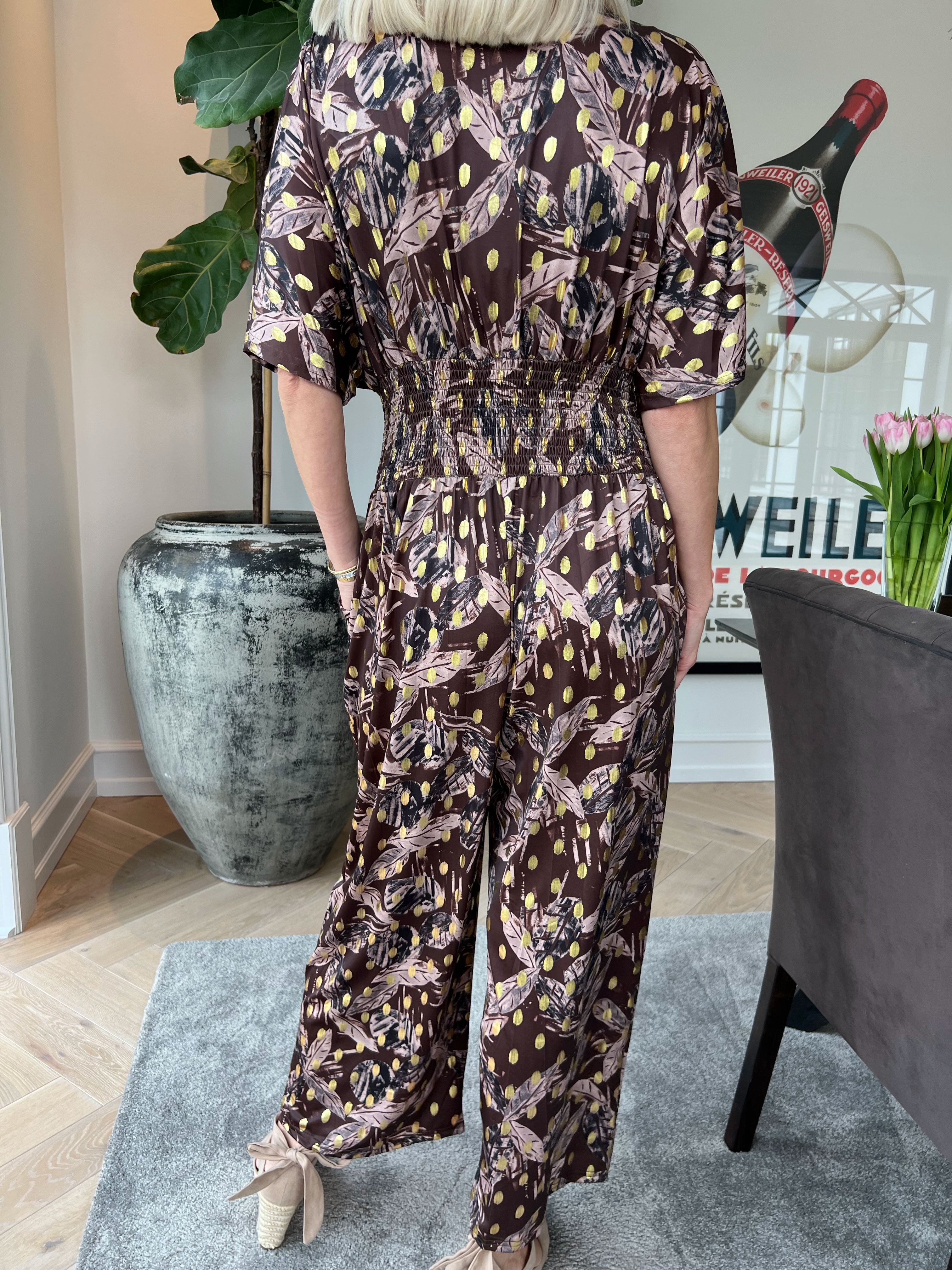 Pams Leafage Jumpsuit - Elastisk buksedragt i bladmønster med guld dutter