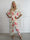 Pams Raise Jumpsuit - Elastisk buksedragt med blomsterr og guldsommerfugle