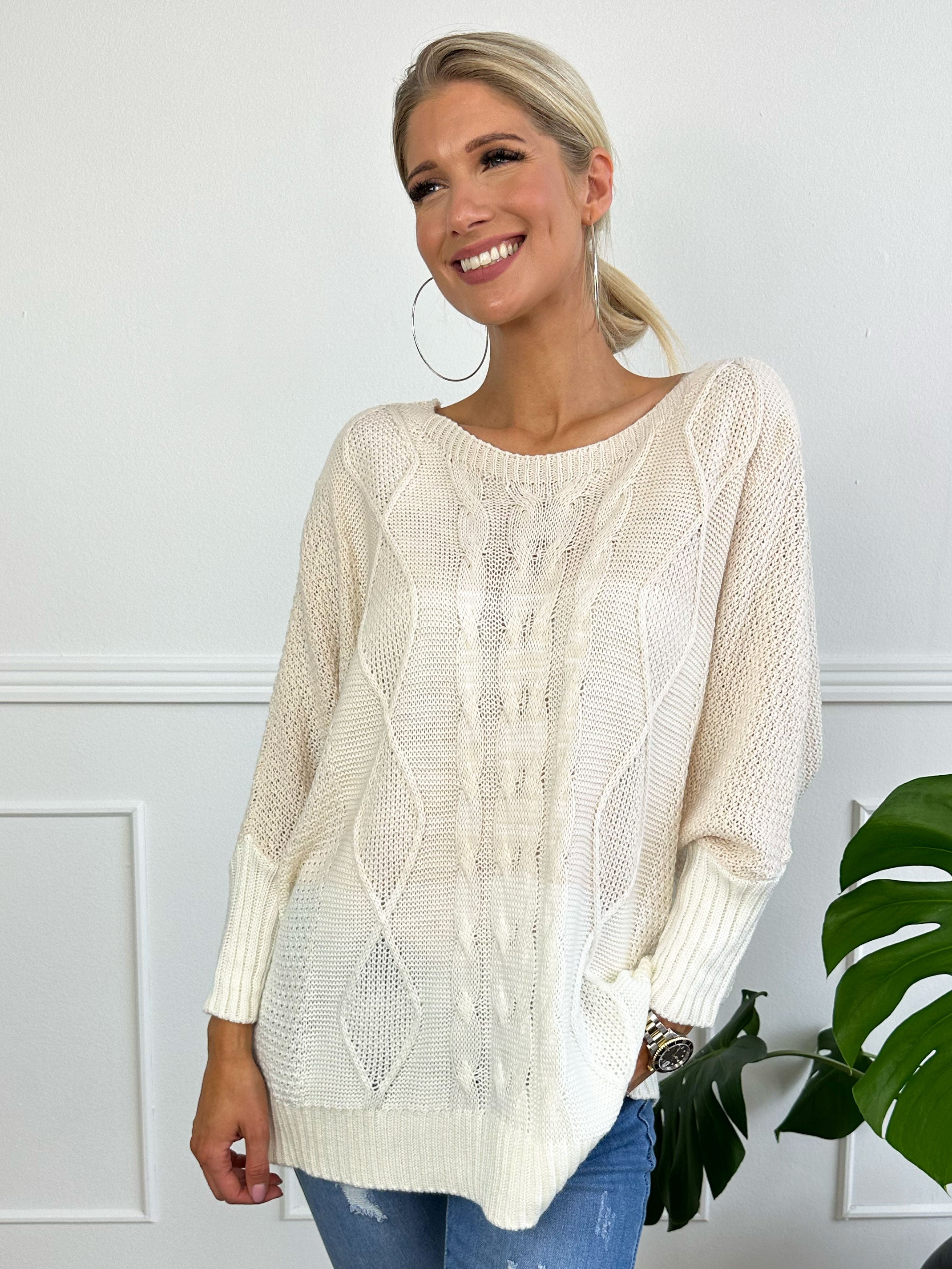 Malika - Flerfarvet strik med flagermusærmer