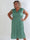 Pams Dot Midi N/S - Elastisk plus size kjole med prikker og smock i livet