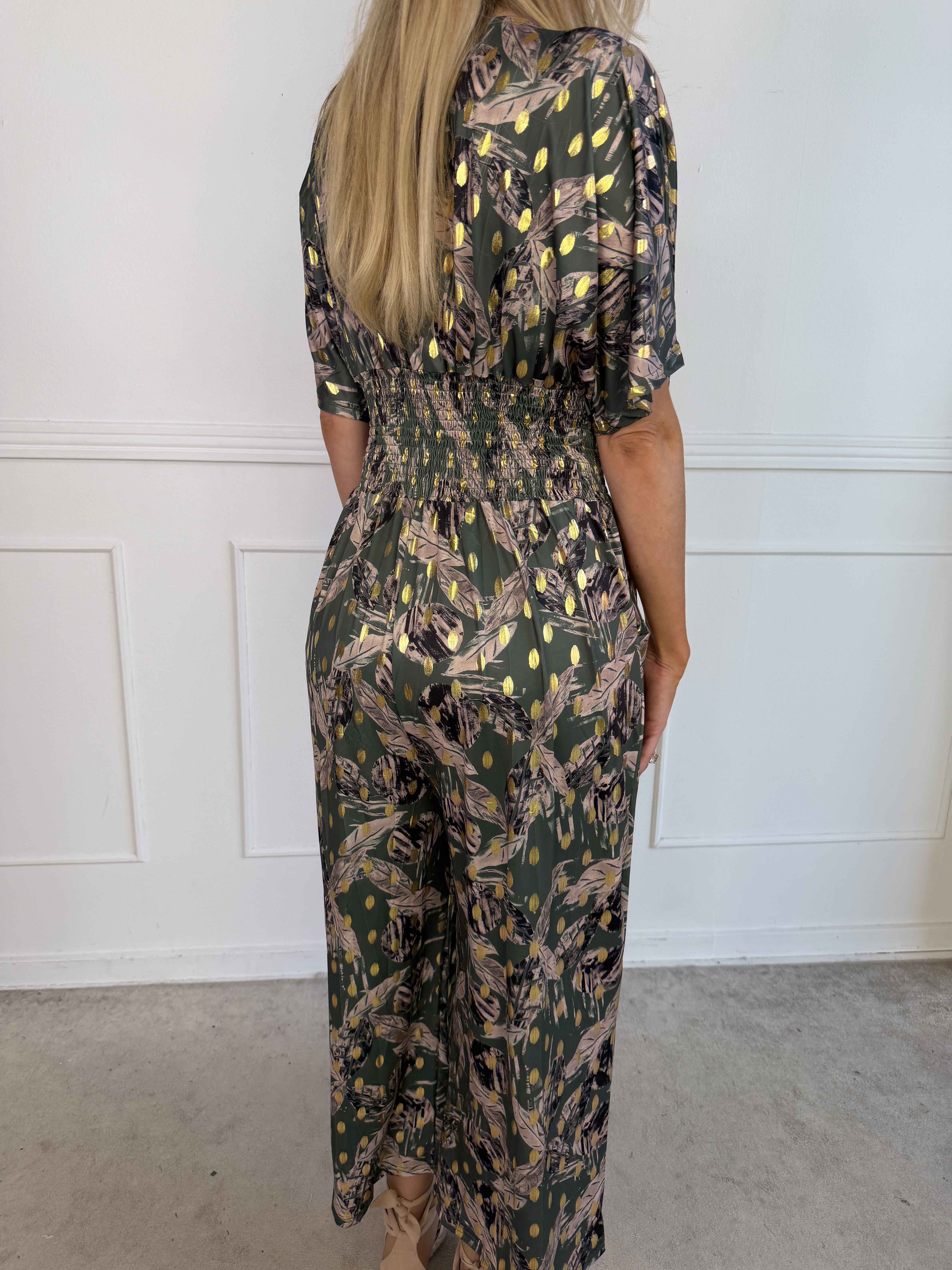 Pams Leafage Jumpsuit - Elastisk buksedragt i bladmønster med guld dutter
