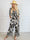 Pams Palm Jumpsuit - Elastisk buksedragt med palmeprint