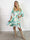 Savina Flower - Blomstret elastisk langærmet kjole i slå-om-look