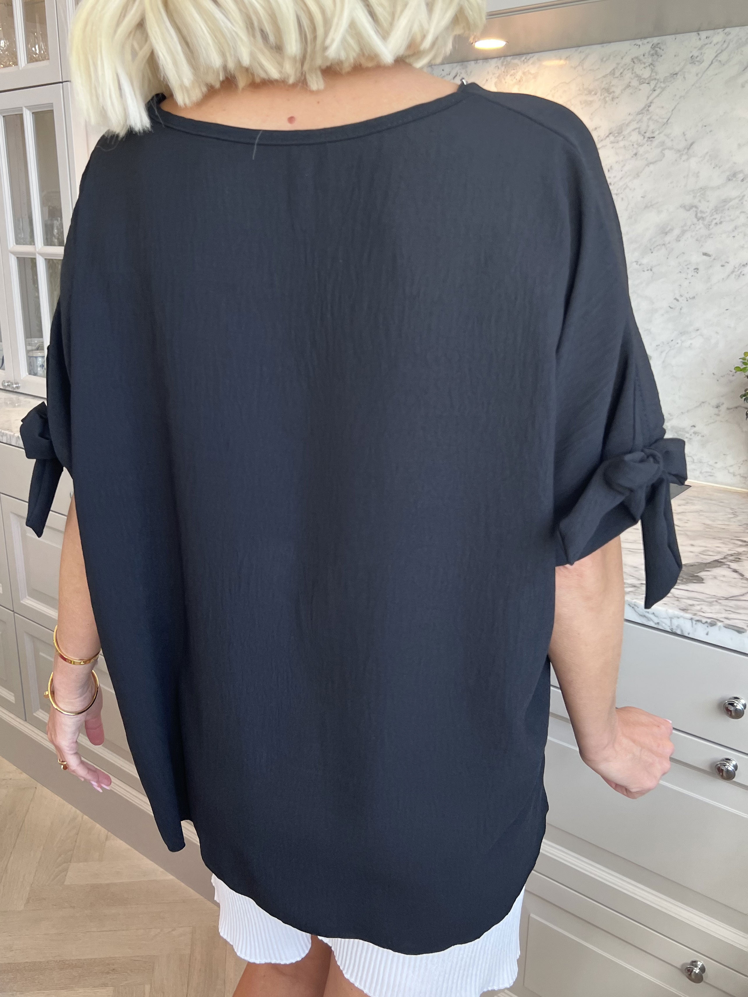 Frankie - Tunika med lynlås og sløje på ærmerne