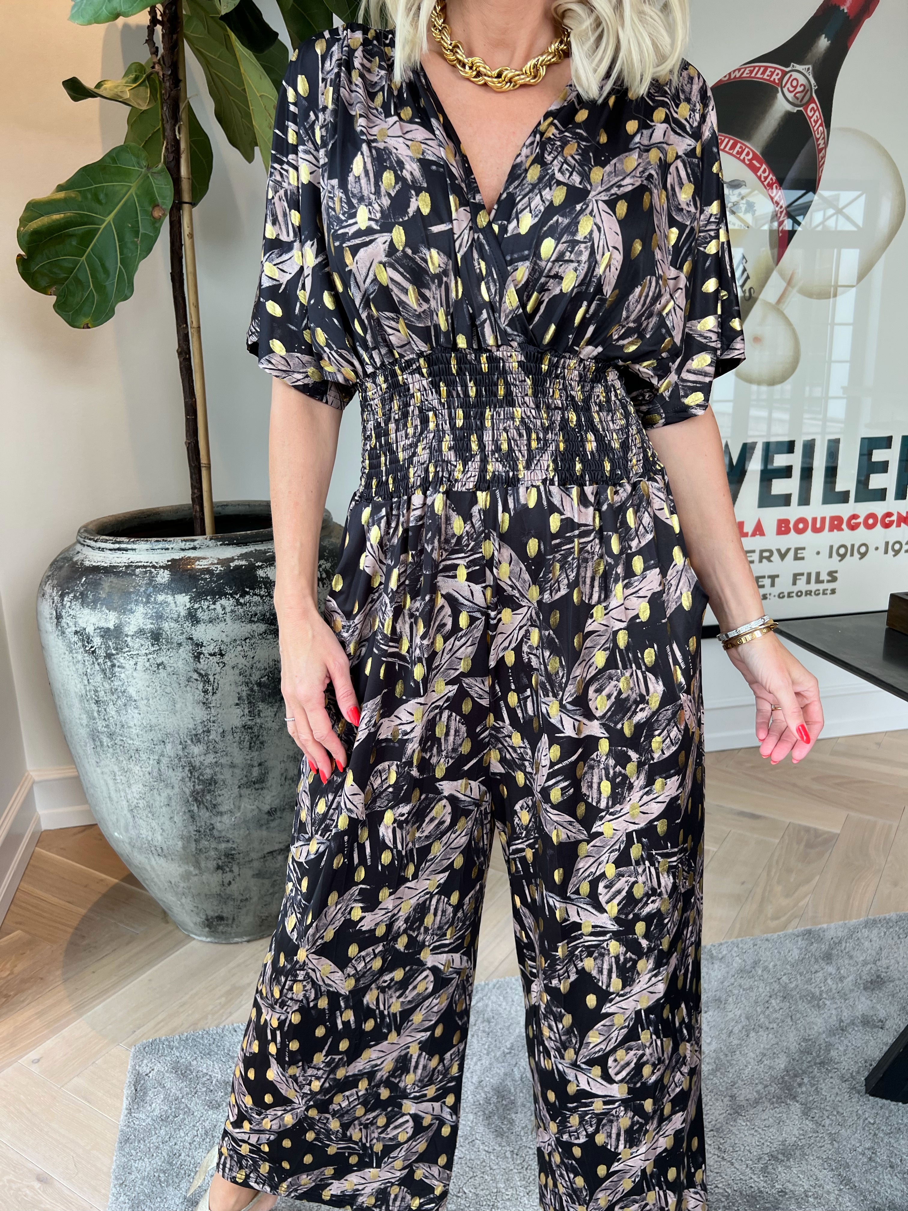 Pams Leafage Jumpsuit - Elastisk buksedragt i bladmønster med guld dutter