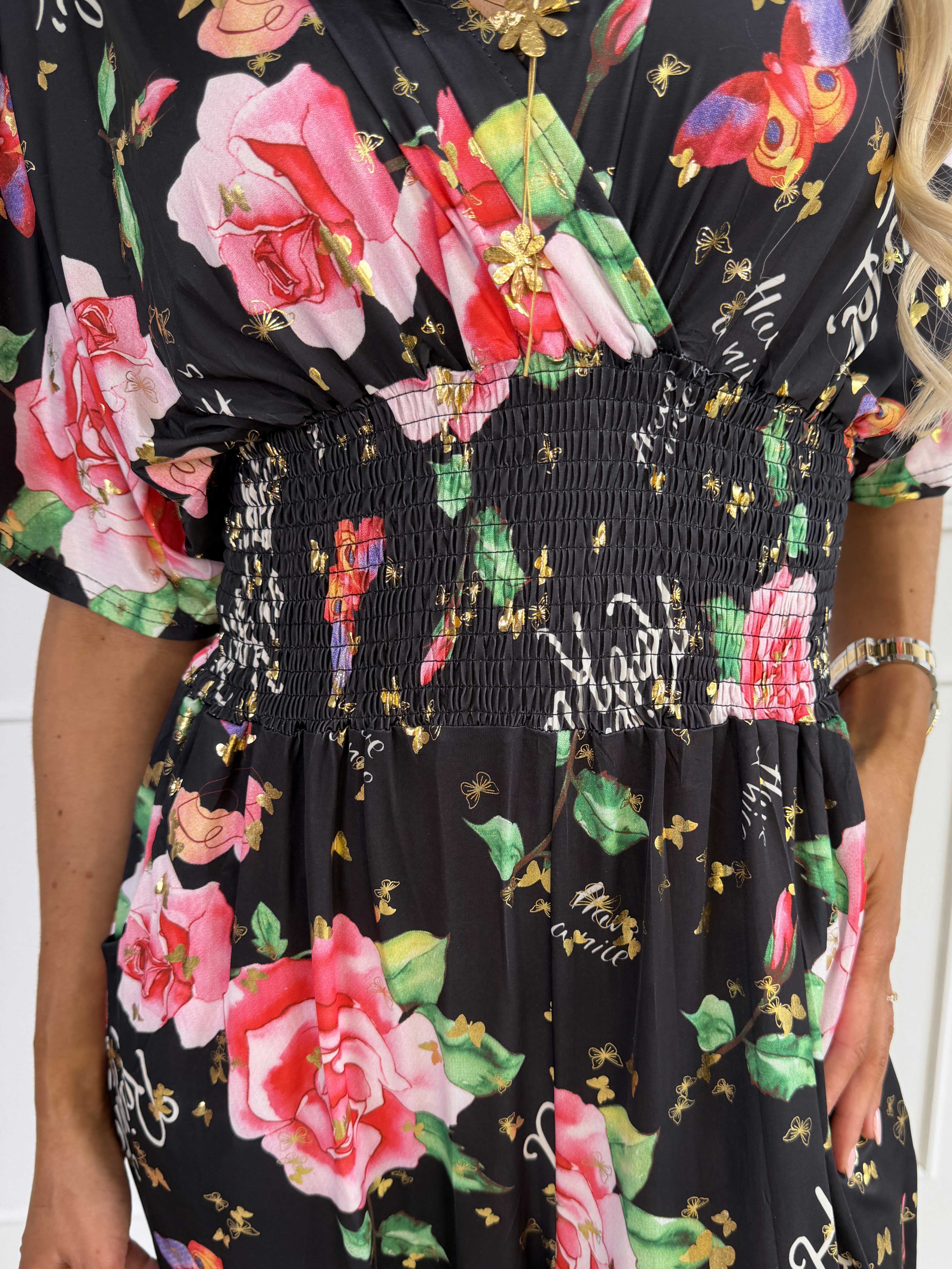 Pams Raise Jumpsuit - Elastisk buksedragt med blomsterr og guldsommerfugle