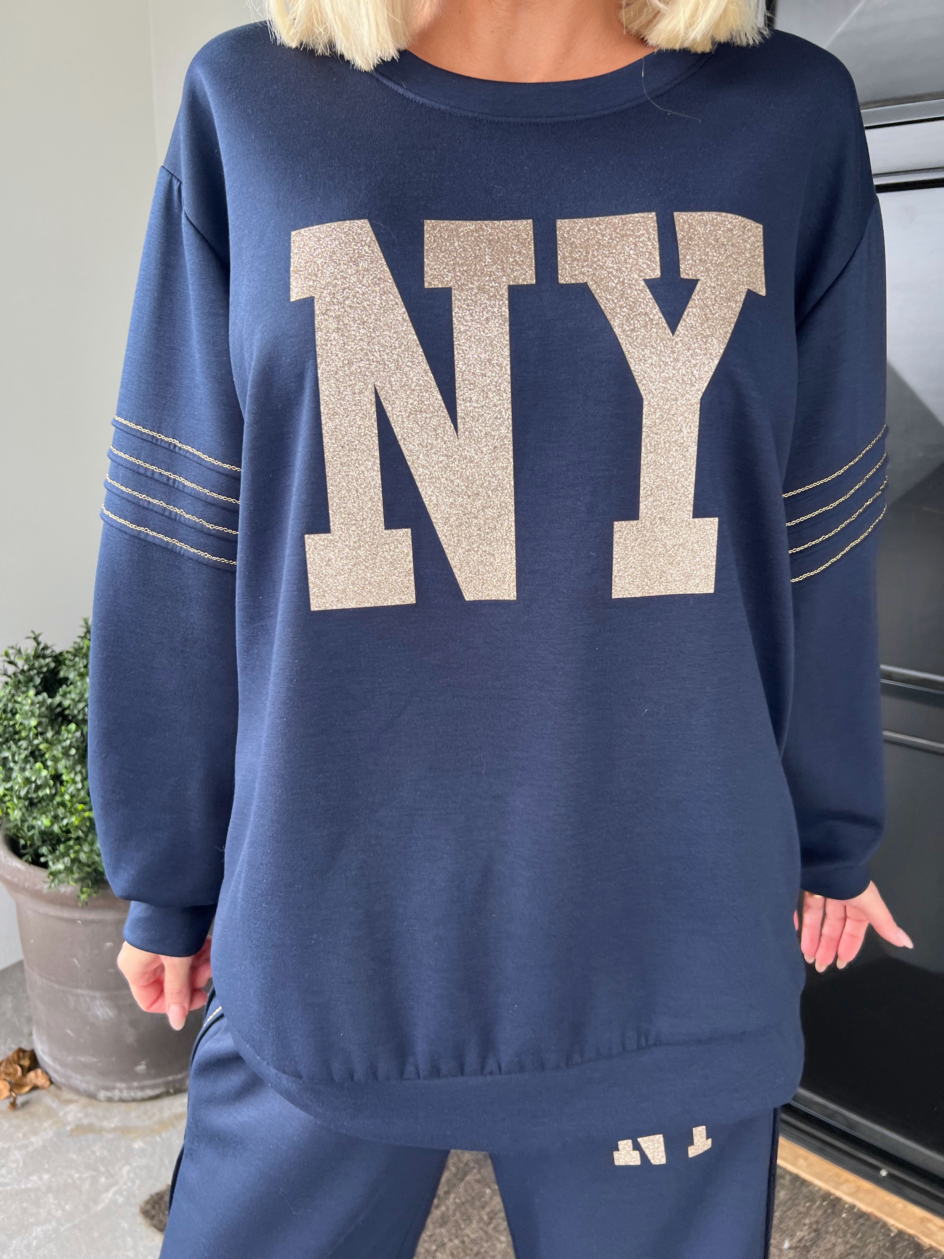 Dream NY - Plus size joggingsæt i viskose med glitrende NEW YORK-tekst på maven