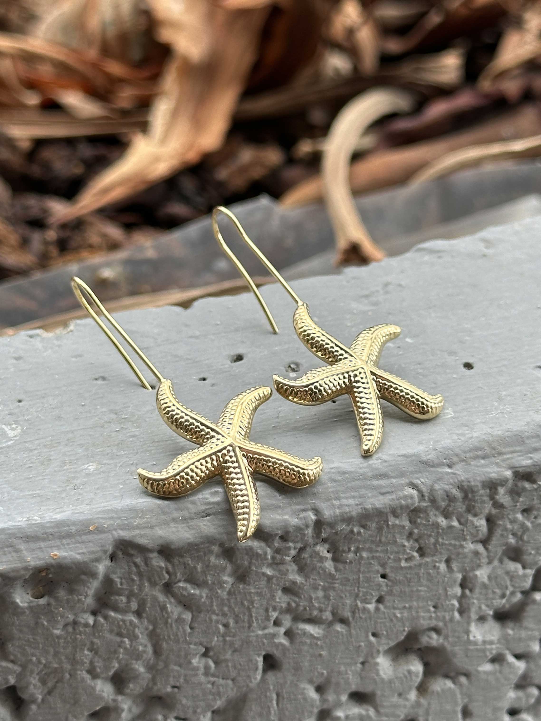 Lottie - Guldfarvede øreringe med søstjerne vedhæng