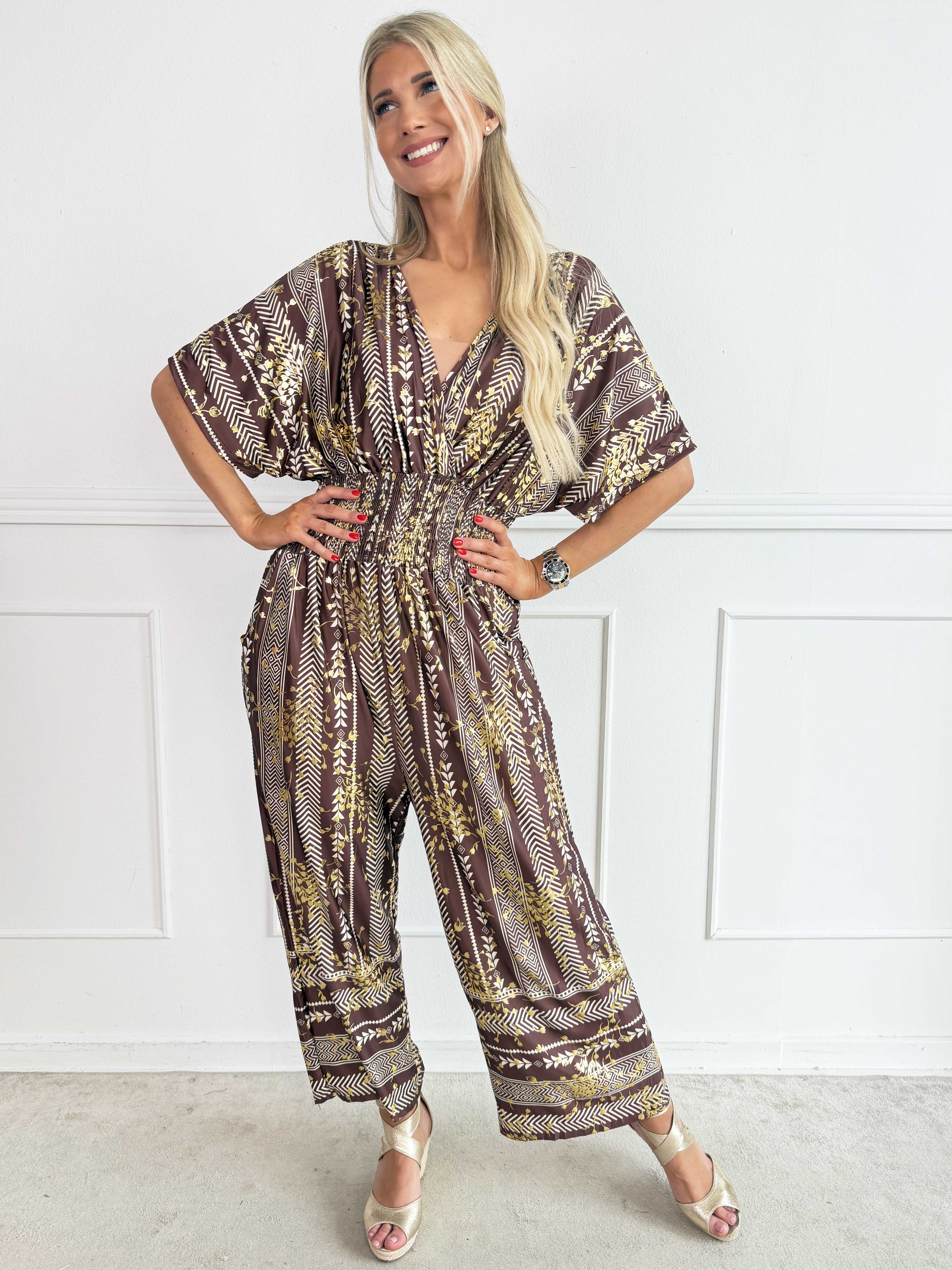 Pams Tribal Jumpsuit - Elastisk mønstret buksedragt med små guld blomster