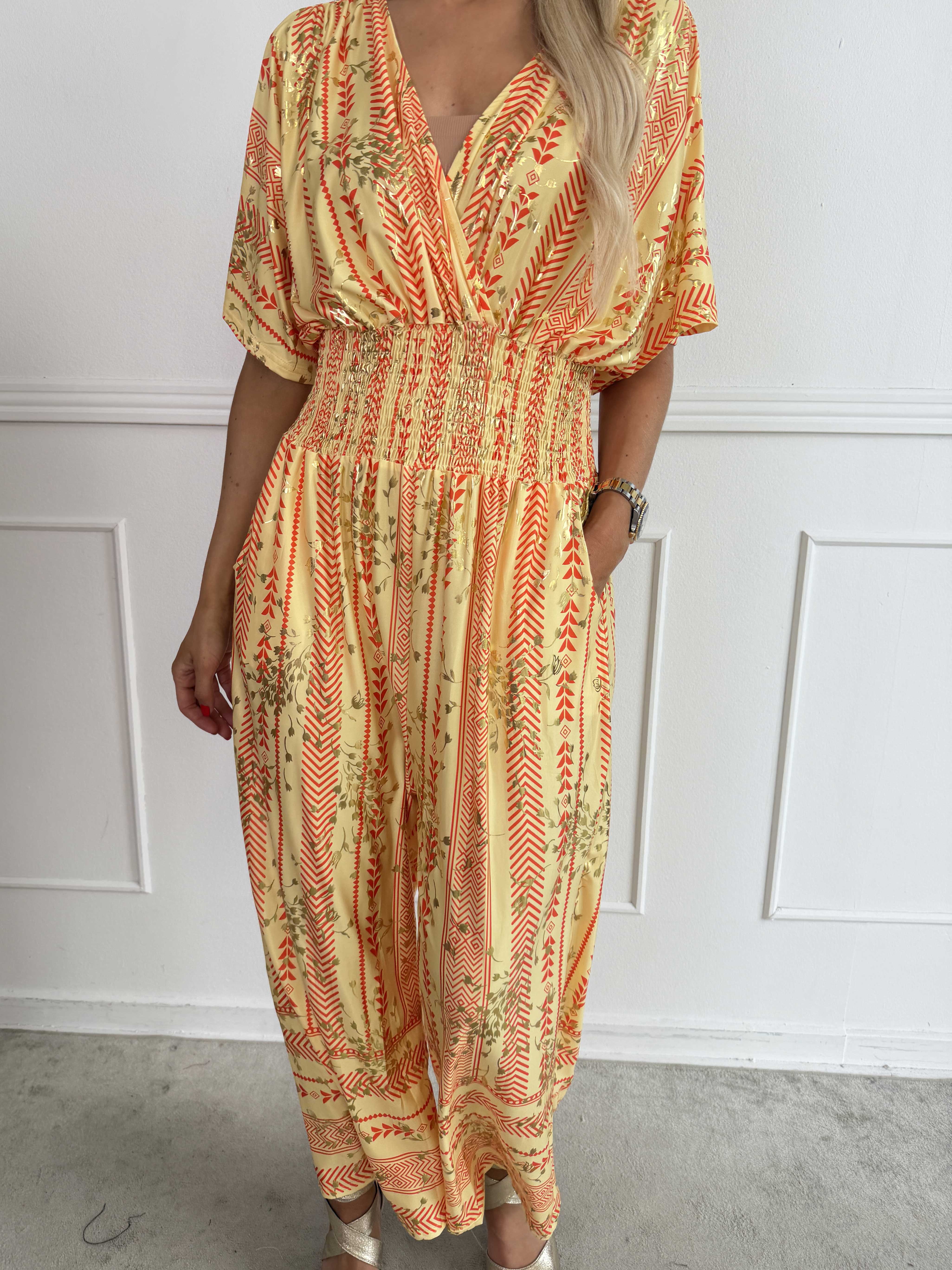 Pams Tribal Jumpsuit - Elastisk mønstret buksedragt med små guld blomster