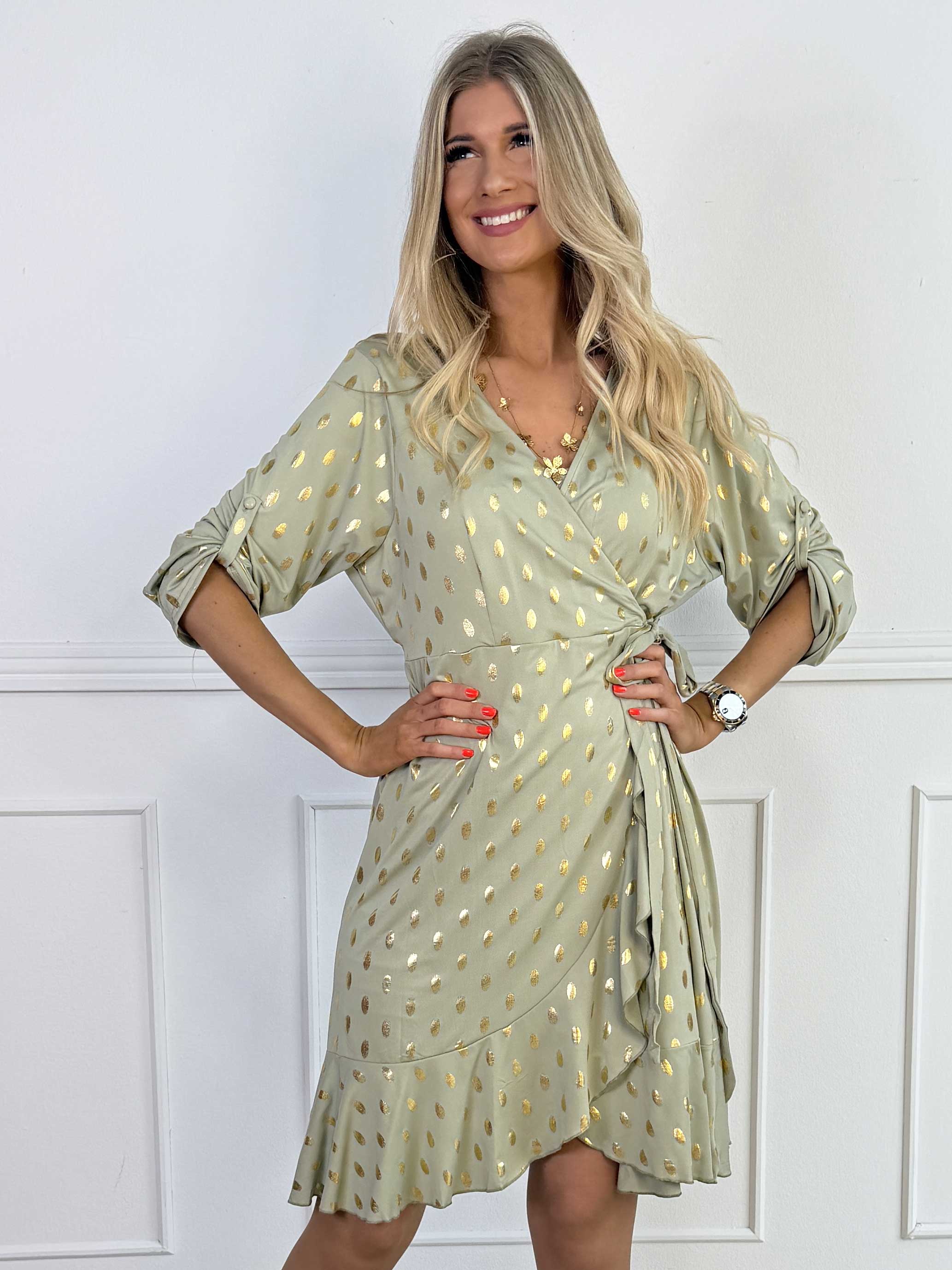 Savina Gold - Elastisk kjole i slå-om-look med guld dutter