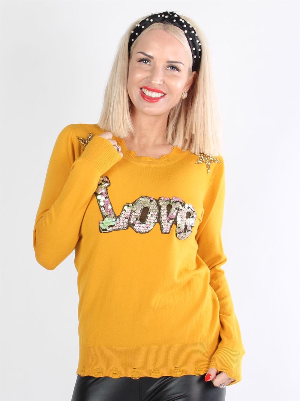 Kelvina - Beigefarvet bluse med tekst og stjerner af pailletter og similisten