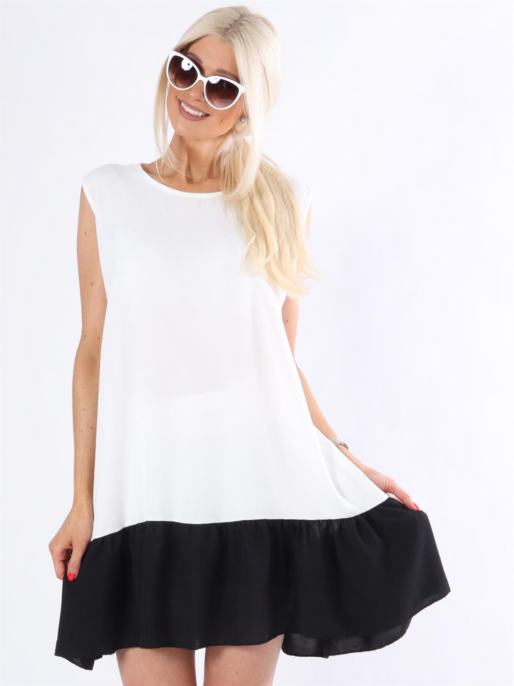 Manola - Kjole i løs pasform med flæsekant forneden