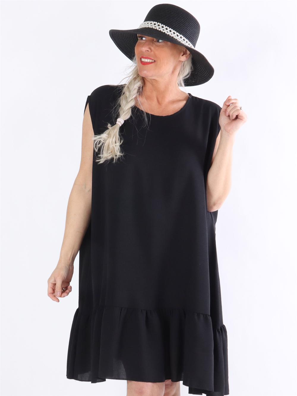 Manola - Kjole i løs pasform med flæsekant forneden