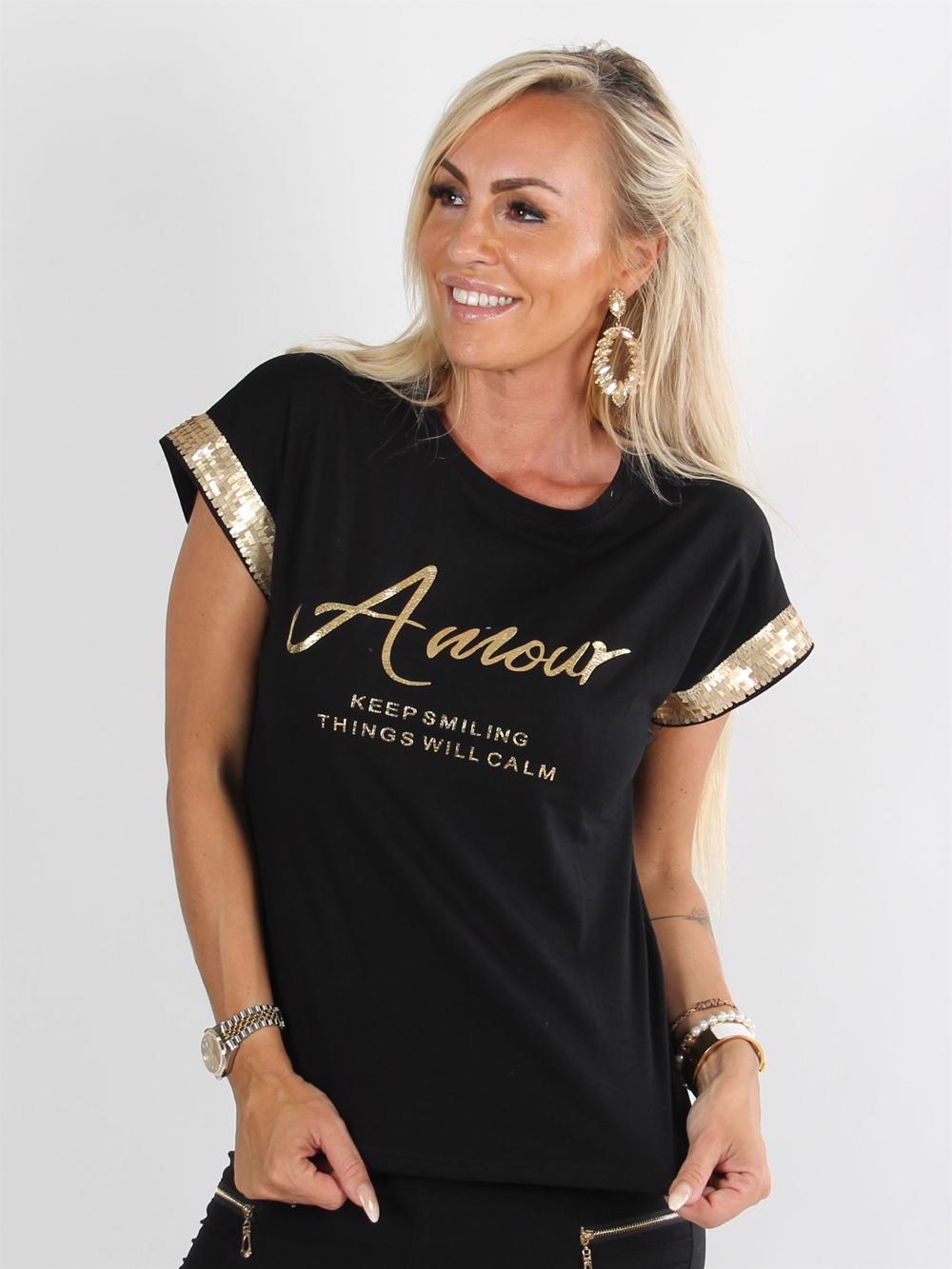 Melilla - Sort t-shirt med guld skrift og guld pailletter på ærmerne