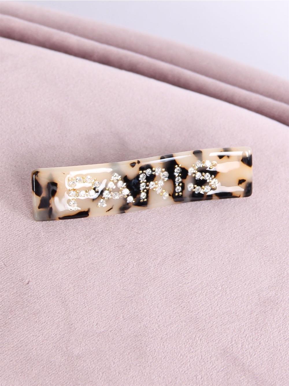 Teresa - Guldfarvet spænde med Paris skrevet i similisten